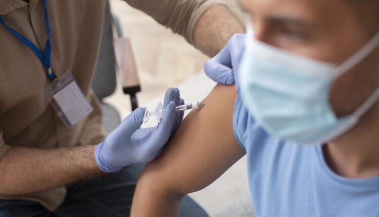 close-up-man-getting-vaccinated-scaled